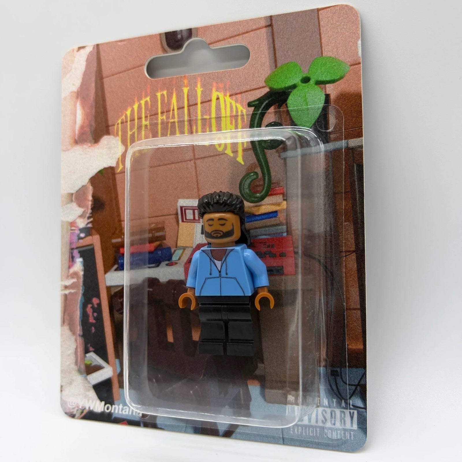 J. Cole custom minifigure in blue hoodie, black pants, displayed in "The Fall Off" themed packaging.