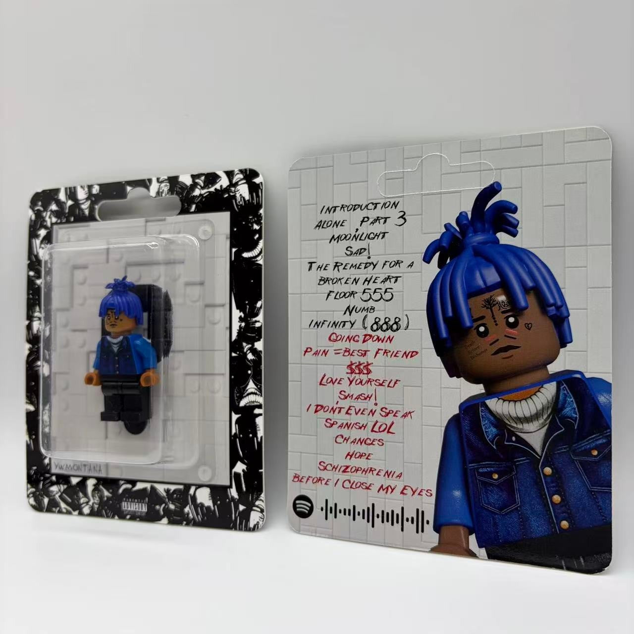XXXTentacion custom minifigure with blue hair, displayed in a sealed blister pack with artistic card.