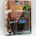 J. Cole custom minifigure in blue hoodie, sealed in "The Fall Off" album art blister packaging.