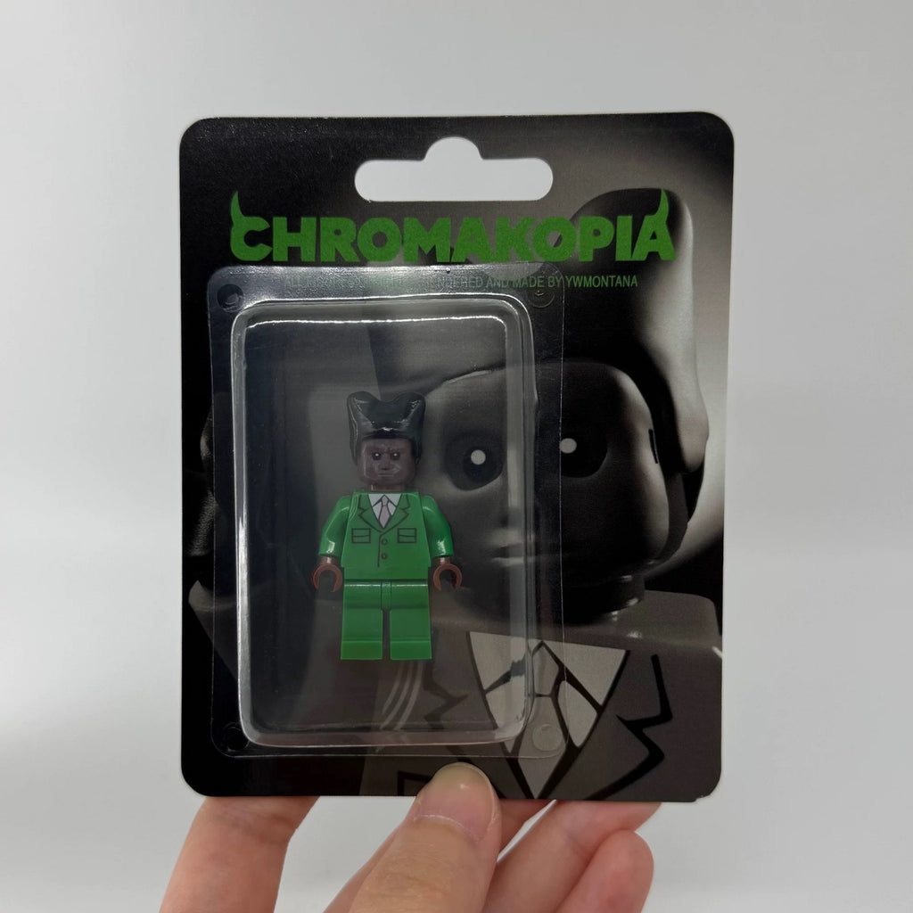 Tyler The Creator Chromakopia Minifigure in green suit, unique hair, blister pack with album art.