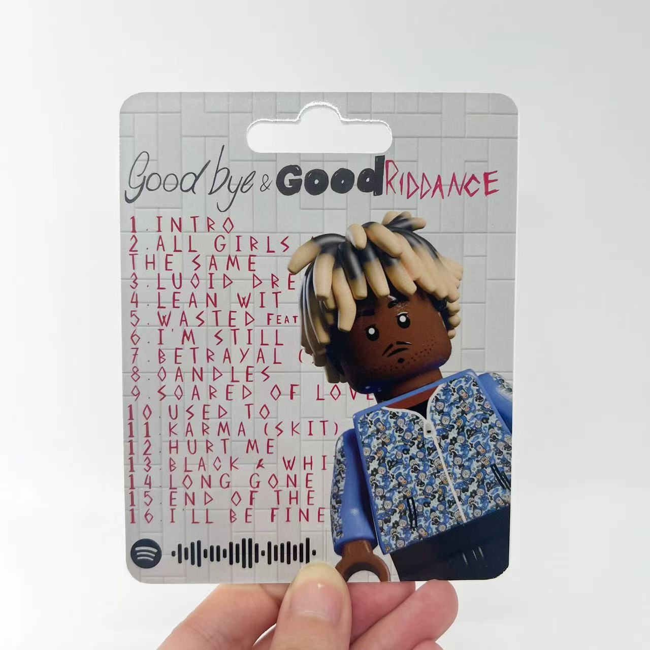 Juice WRLD "Goodbye & Good Riddance" minifigure in blister pack, featuring iconic album visuals.