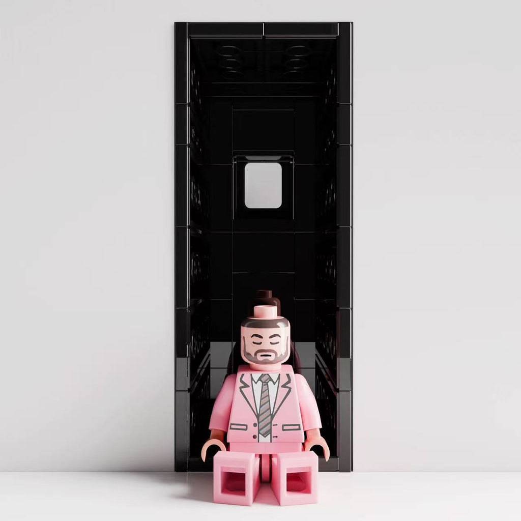 Mac Miller "Swimming" custom minifigure in a pink suit, featuring detailed facial print, sitting position.