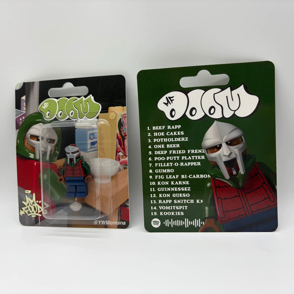 MF DOOM "MM...FOOD" custom minifigure in blister pack, featuring metallic mask and colorful hooded outfit.